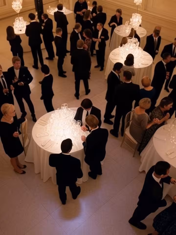 Overhead view of exclusive gala dinner at Metropolitan Museum, elegant guests networking naturally, 